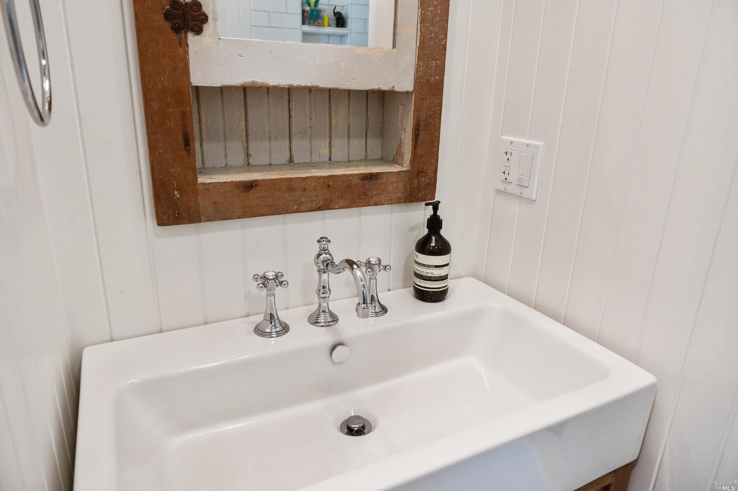 16 Hill Street Mill Valley, CA 94941 - Photo 27 of 55 a bathroom with a sink and a mirror