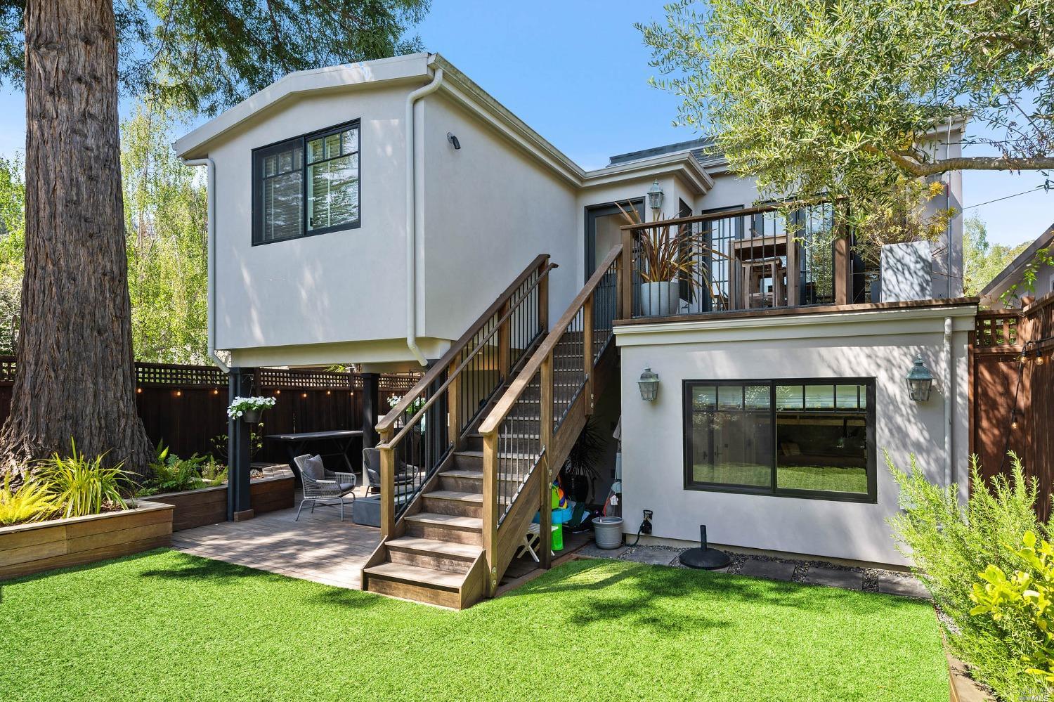 16 Hill Street Mill Valley, CA 94941 - Photo 40 of 55 a view of backyard with a slide and a large tree
