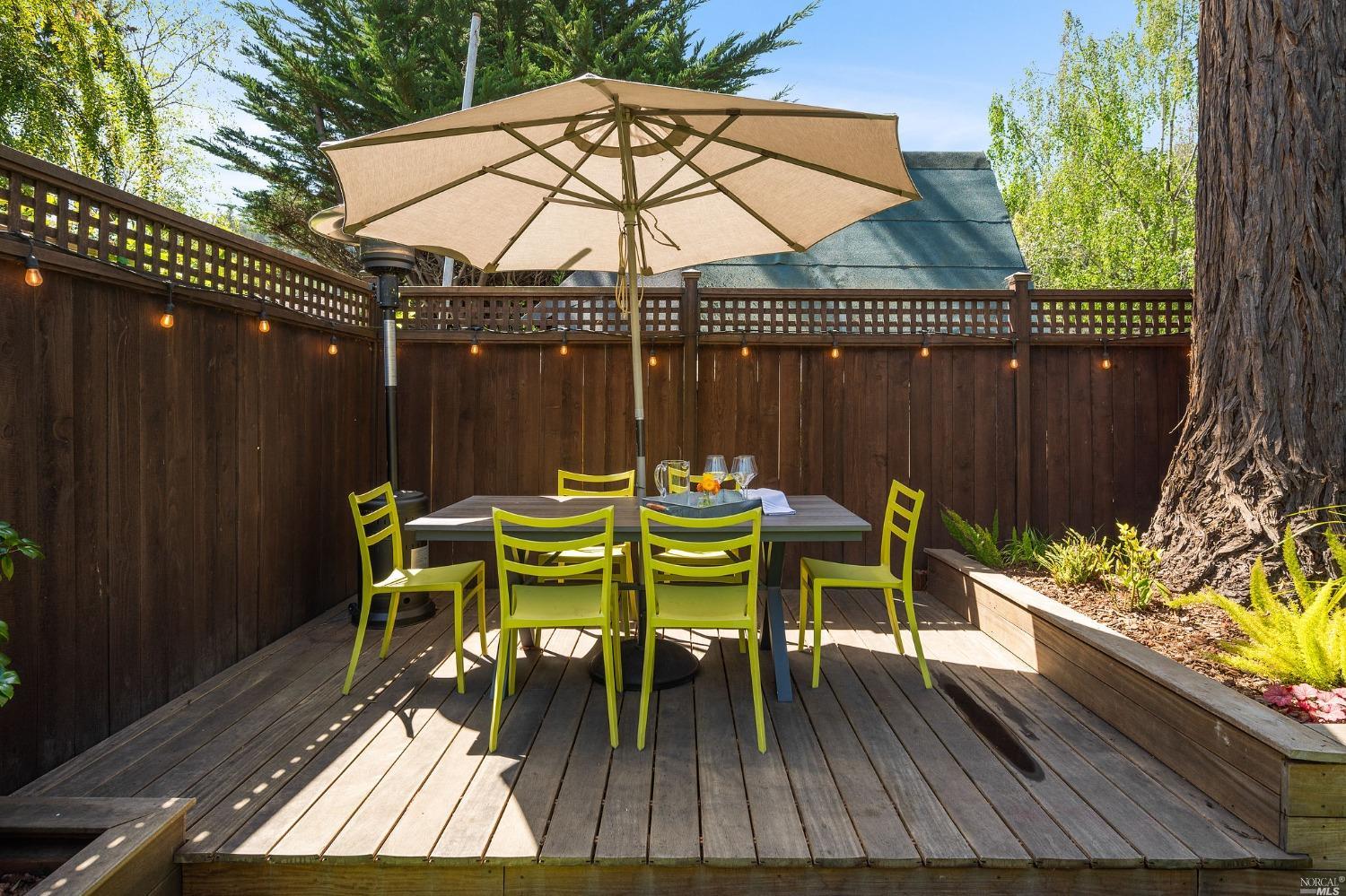 16 Hill Street Mill Valley, CA 94941 - Photo 43 of 55 a view of a chairs and table on the deck with wooden floor