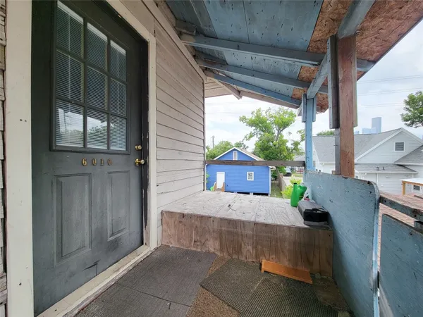 a view of a house with porch and furniture