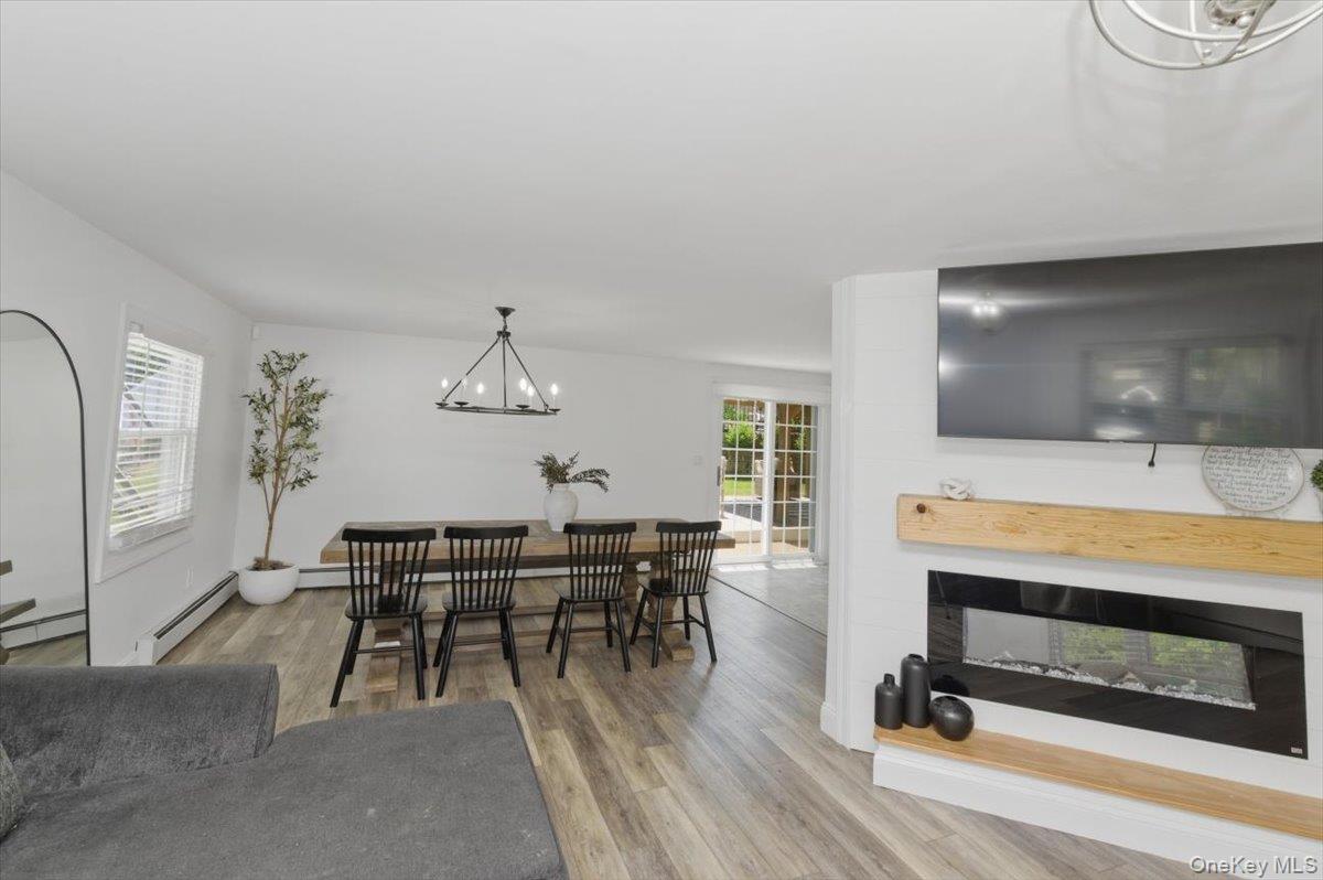 10 Rutgers Road Farmingville, NY 11738 - Photo 6 of 27 a view of a livingroom with furniture and wooden floor