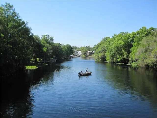 a view of a chairs and table in the balcony