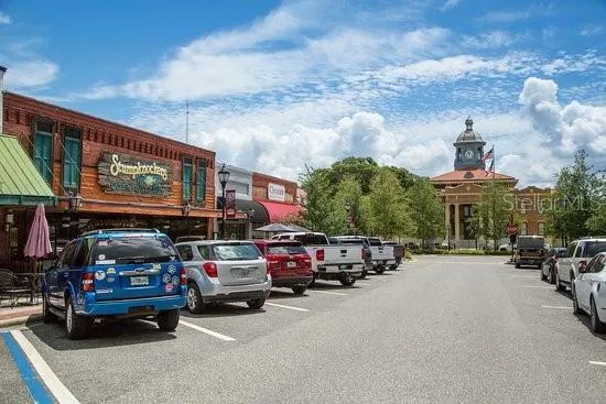a view of parking with cars parked