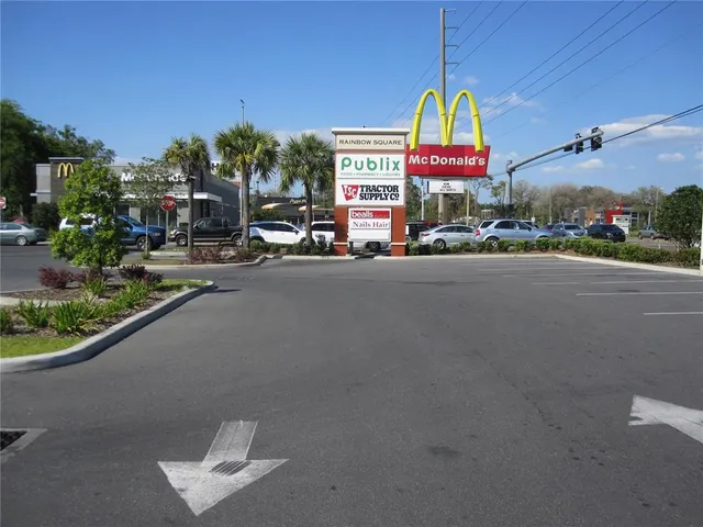 a view of yard with green space and covered outdoor seating