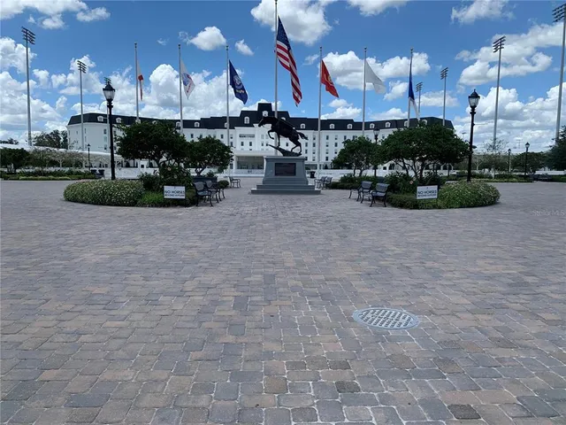 a view of a fountain in front of a house