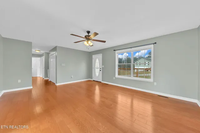 a view of an empty room with a window