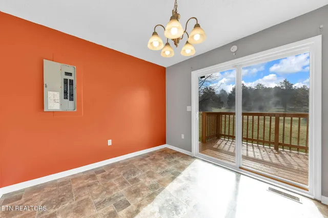 a view of a room with a large window