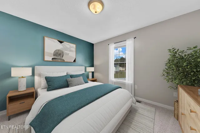 a bedroom with bed and a window