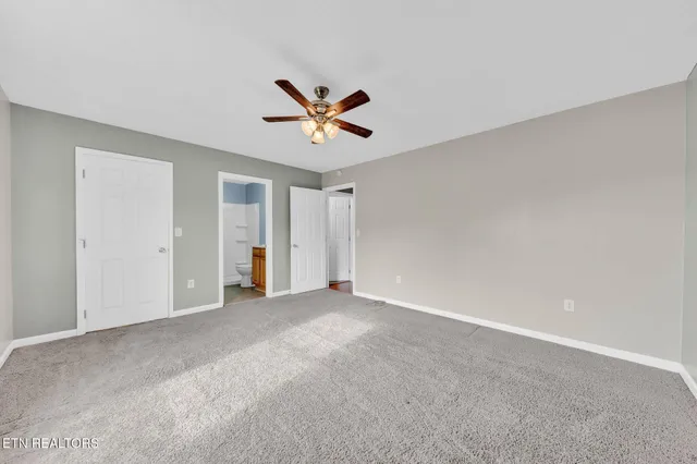 a view of a big room with carpet