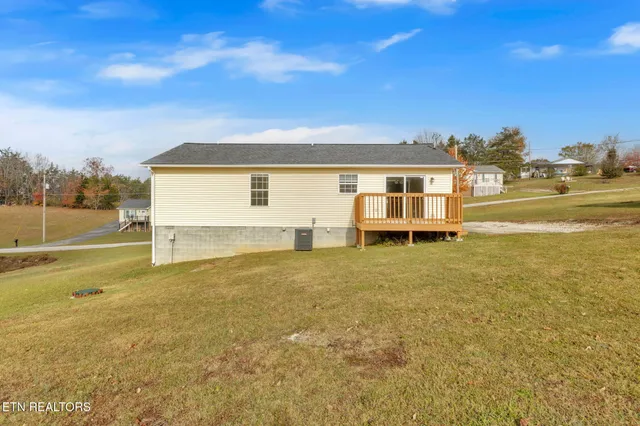 a view of a house with a big yard