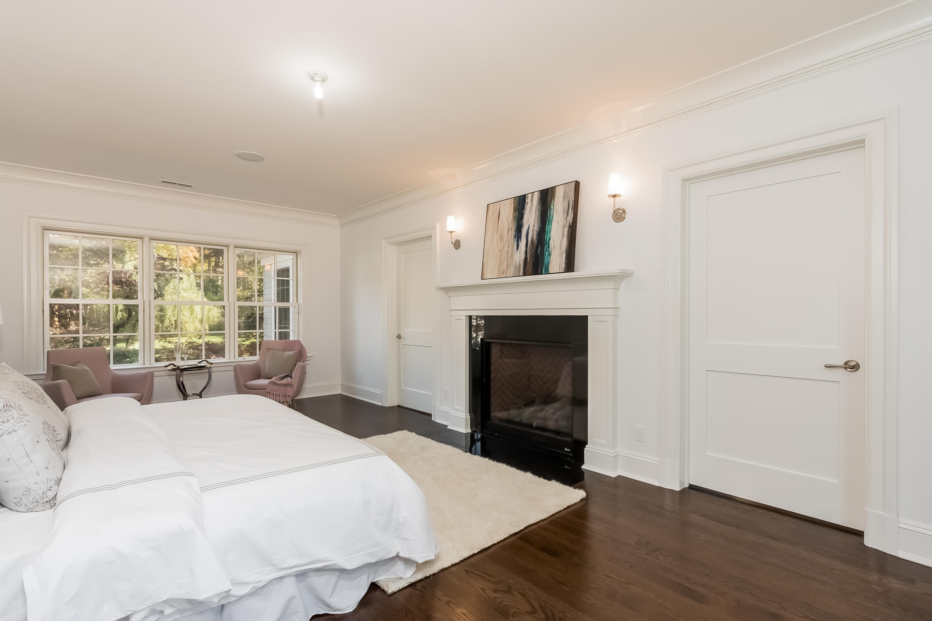 36 Briar Brae Road Darien, CT 06820 - Photo 21 of 37 a large bedroom with a bed and a fireplace