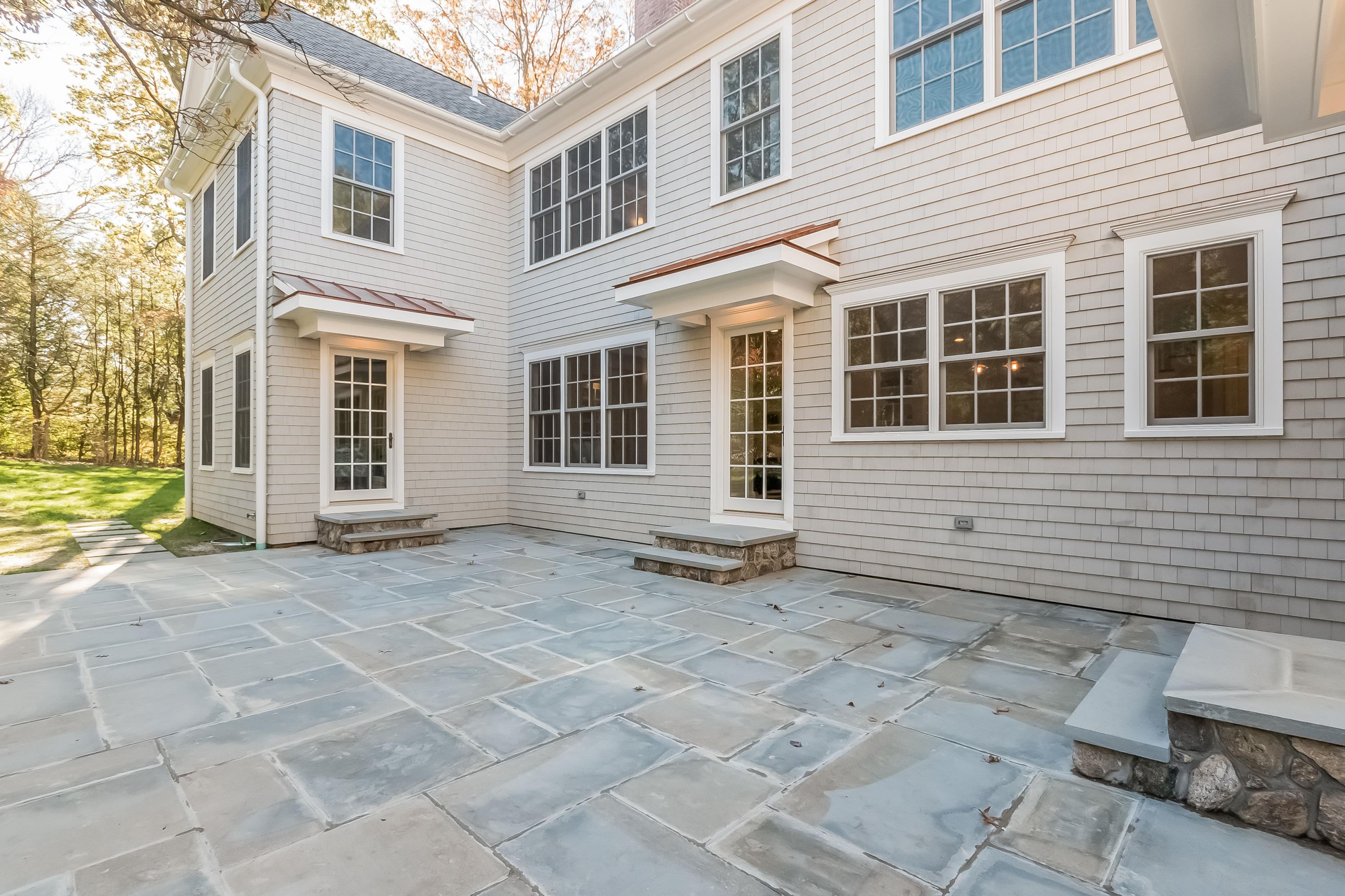 36 Briar Brae Road Darien, CT 06820 - Photo 33 of 37 a view of a brick house with many windows