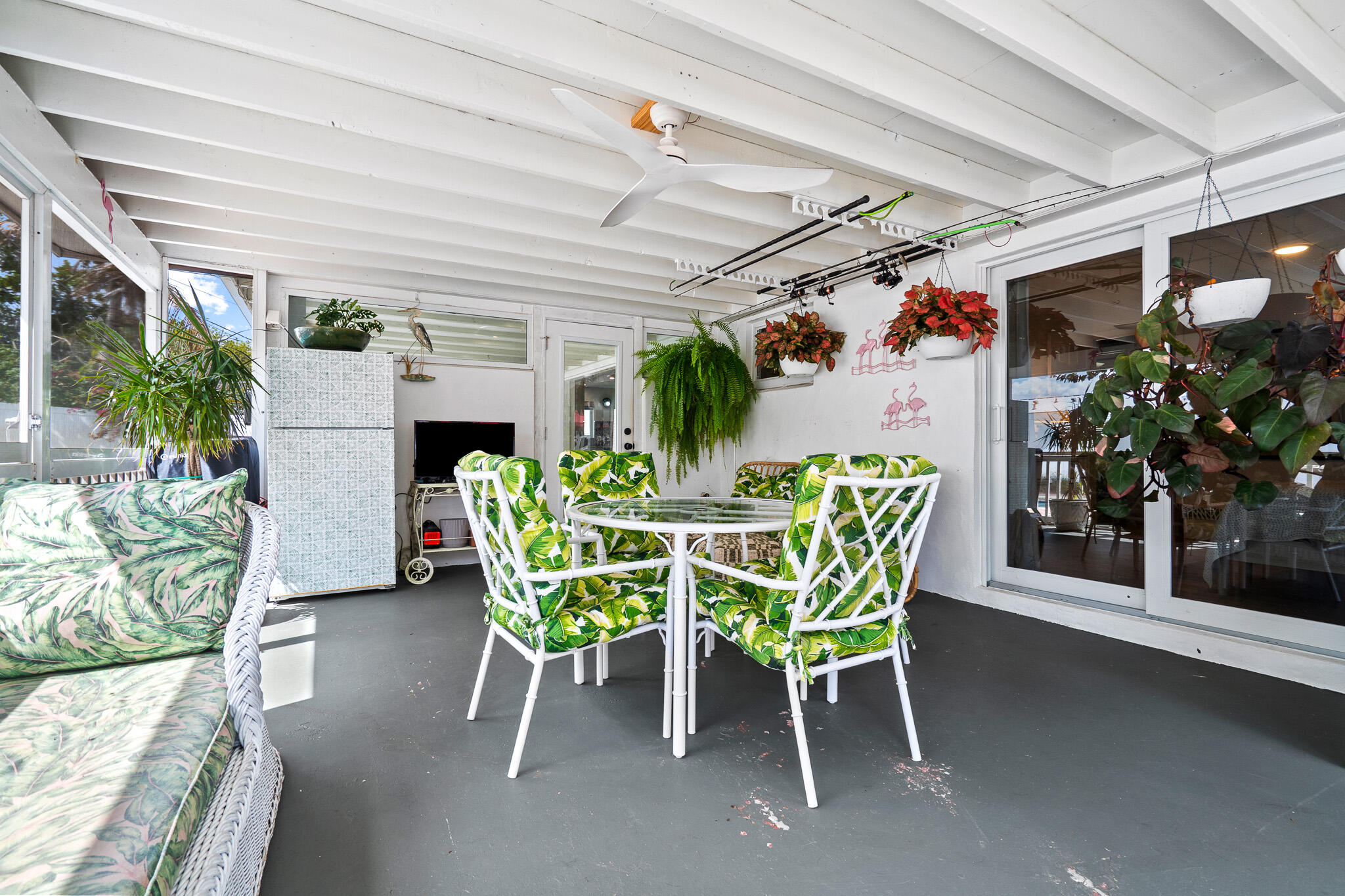 520 Flotilla Road North Palm Beach, FL 33408 - Photo 26 of 30 a dining room with furniture and potted plants