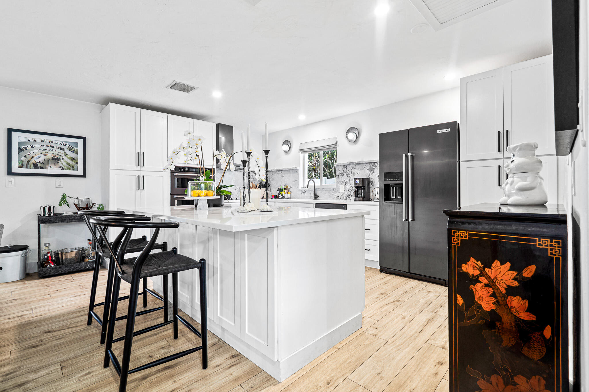 520 Flotilla Road North Palm Beach, FL 33408 - Photo 4 of 30 a kitchen with stainless steel appliances granite countertop a refrigerator and a stove top oven