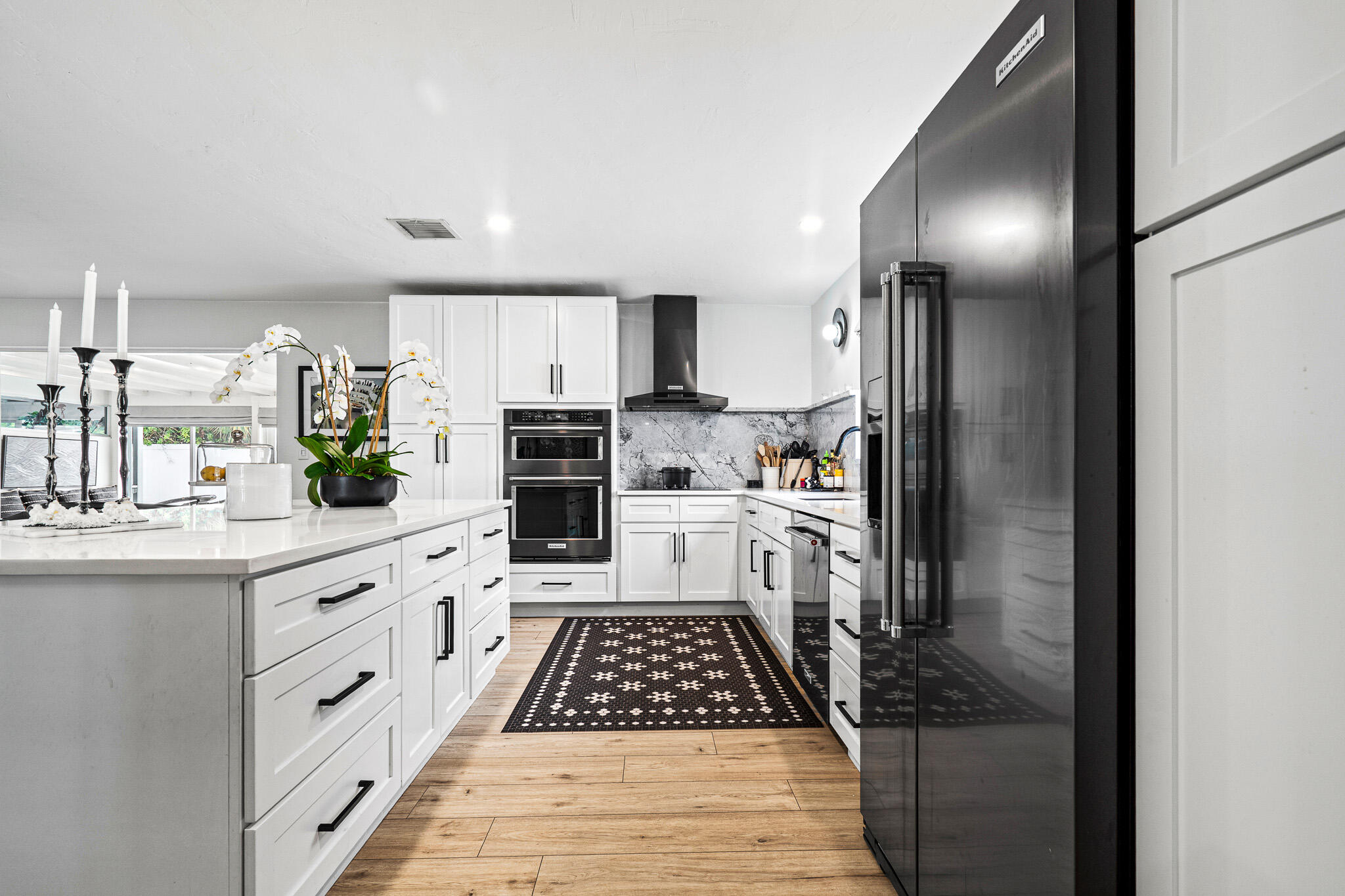 520 Flotilla Road North Palm Beach, FL 33408 - Photo 6 of 30 a kitchen with stainless steel appliances a refrigerator sink and stove
