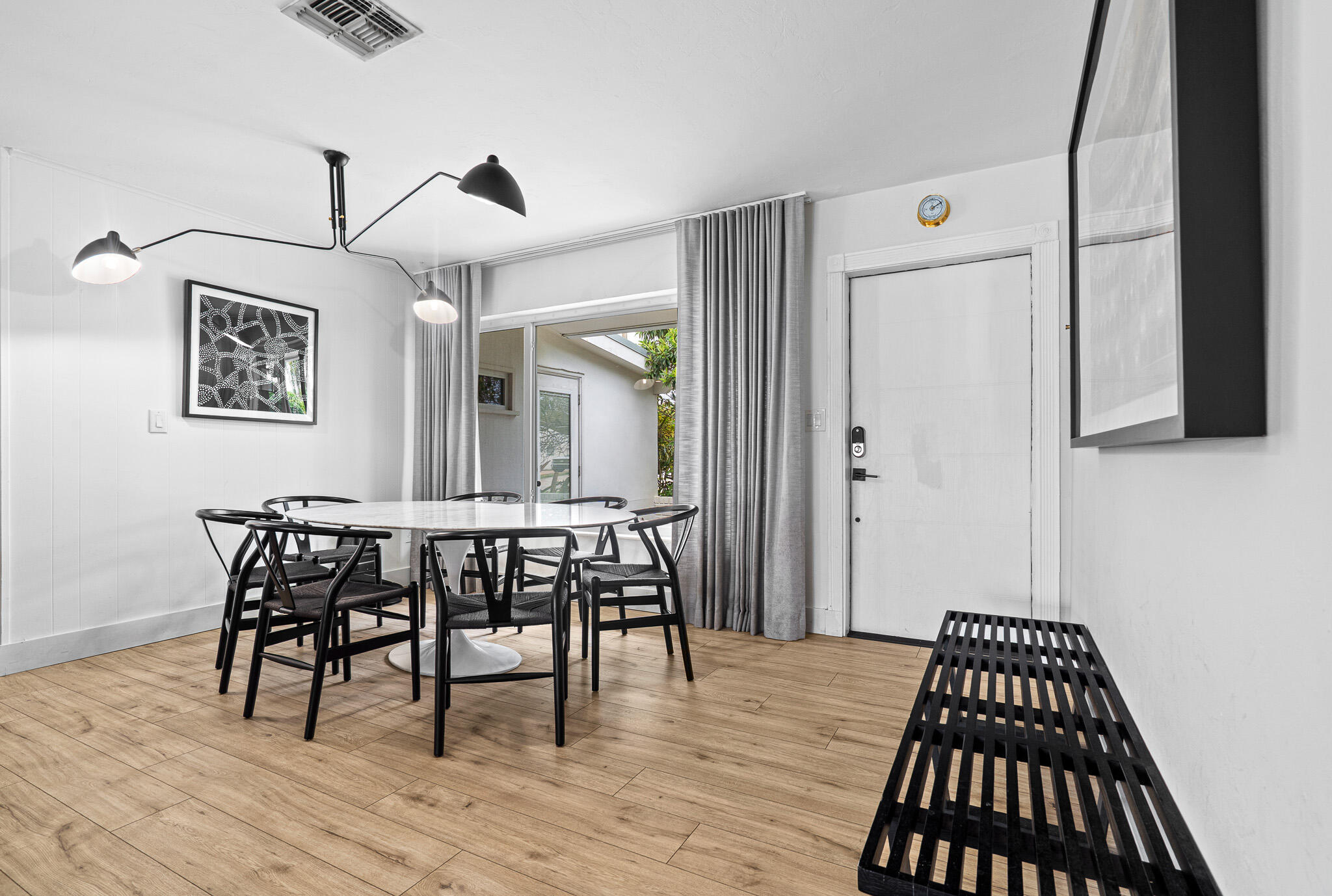 520 Flotilla Road North Palm Beach, FL 33408 - Photo 7 of 30 a view of a dining room with furniture and wooden floor