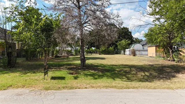 a house with trees in the background