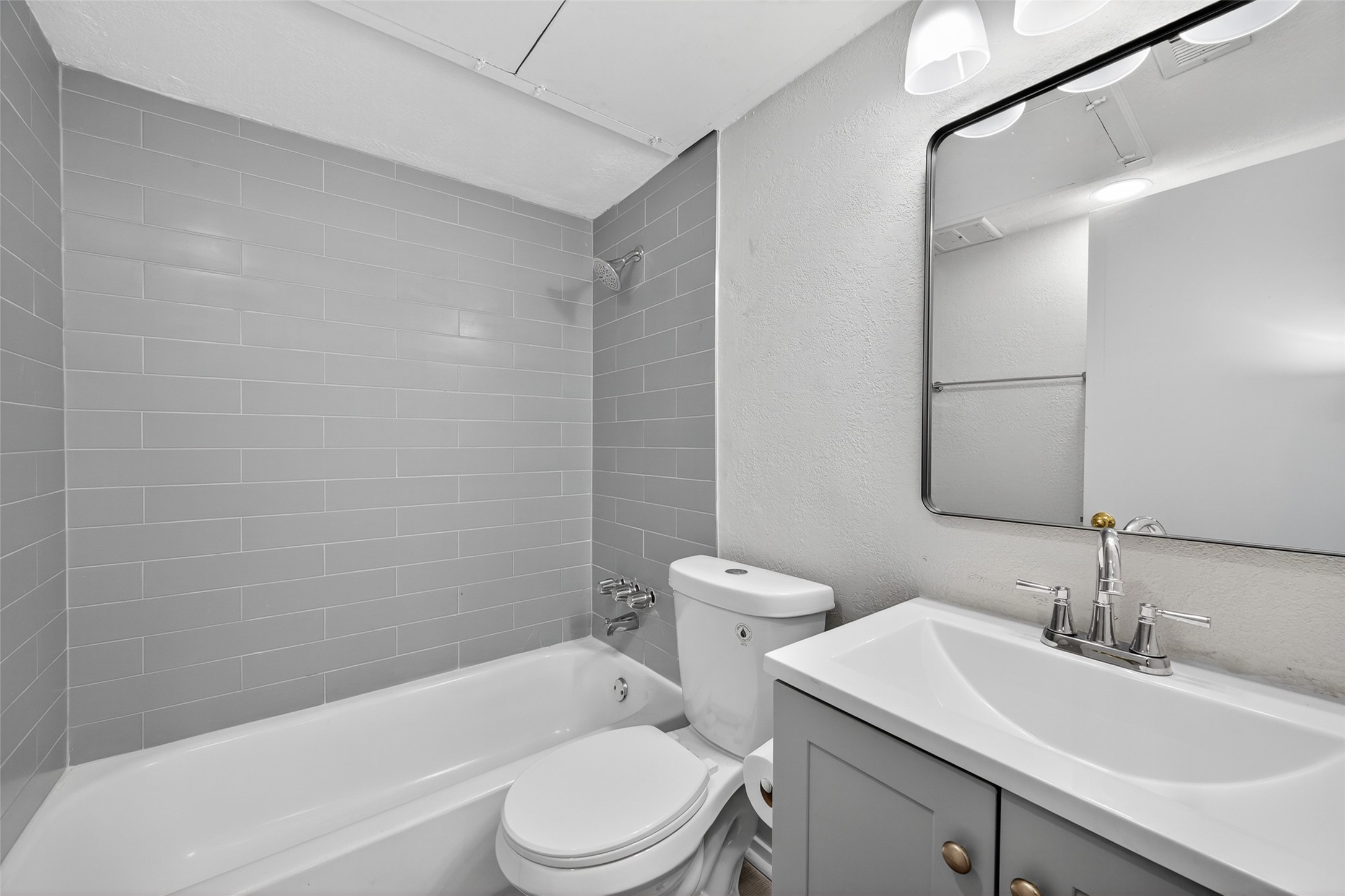 6410 Del Monte Drive, Unit 93 Houston, TX 77057 - Photo 15 of 19 a bathroom with a sink a toilet and shower