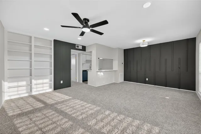 a big room with closet and windows