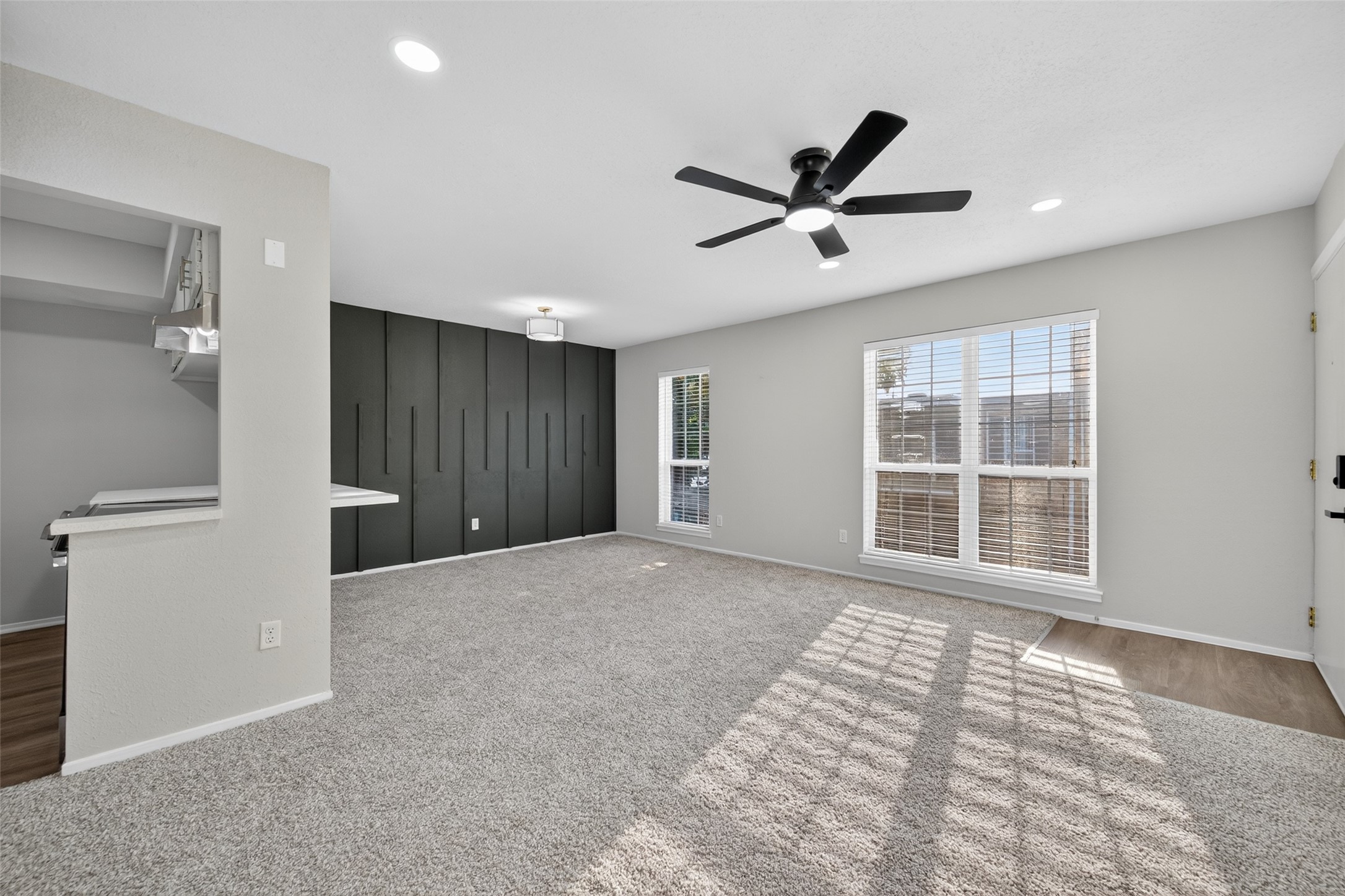 6410 Del Monte Drive, Unit 93 Houston, TX 77057 - Photo 6 of 19 a view of a livingroom with a ceiling fan and window