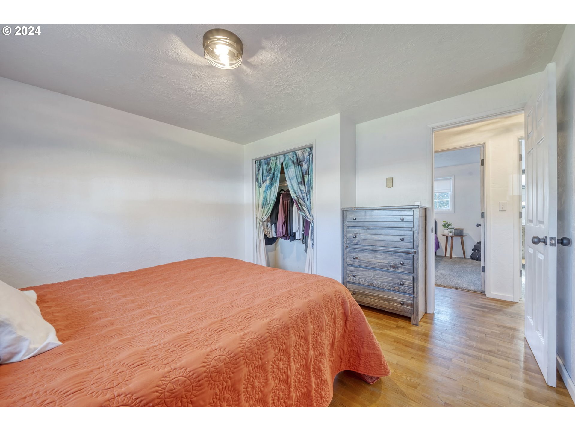 1127 South 34th Place Springfield, OR 97478 - Photo 23 of 40 a bedroom with a bed and a closet