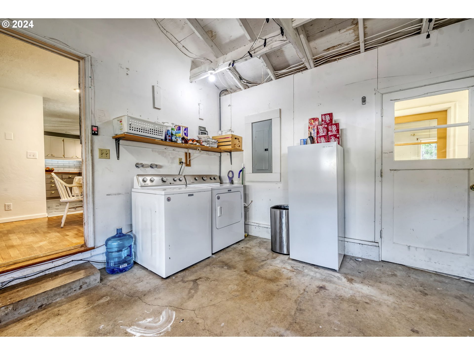 1127 South 34th Place Springfield, OR 97478 - Photo 31 of 40 a view of a storage & utility room with washer and dryer