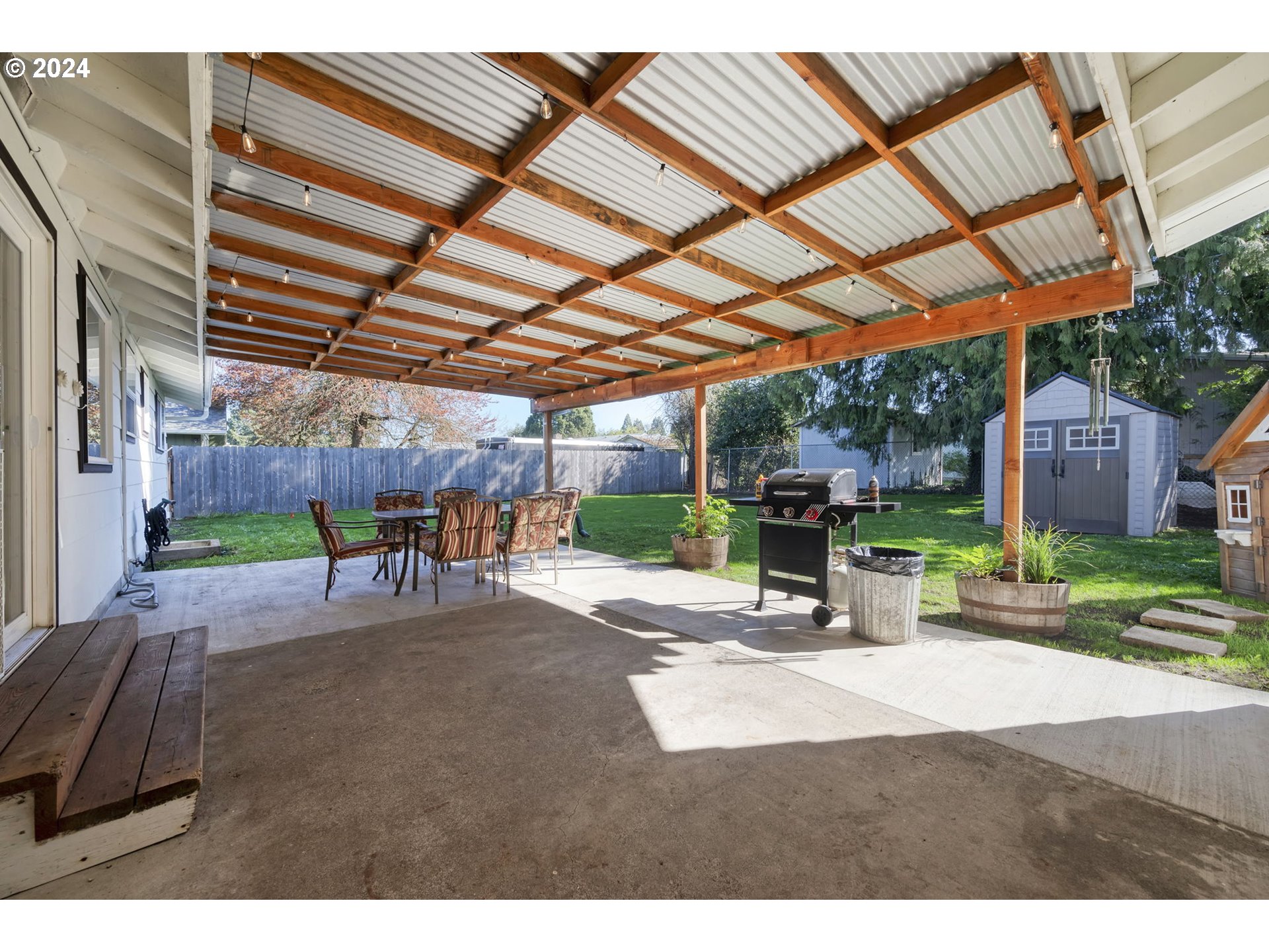 1127 South 34th Place Springfield, OR 97478 - Photo 32 of 40 a view of a backyard with a patio