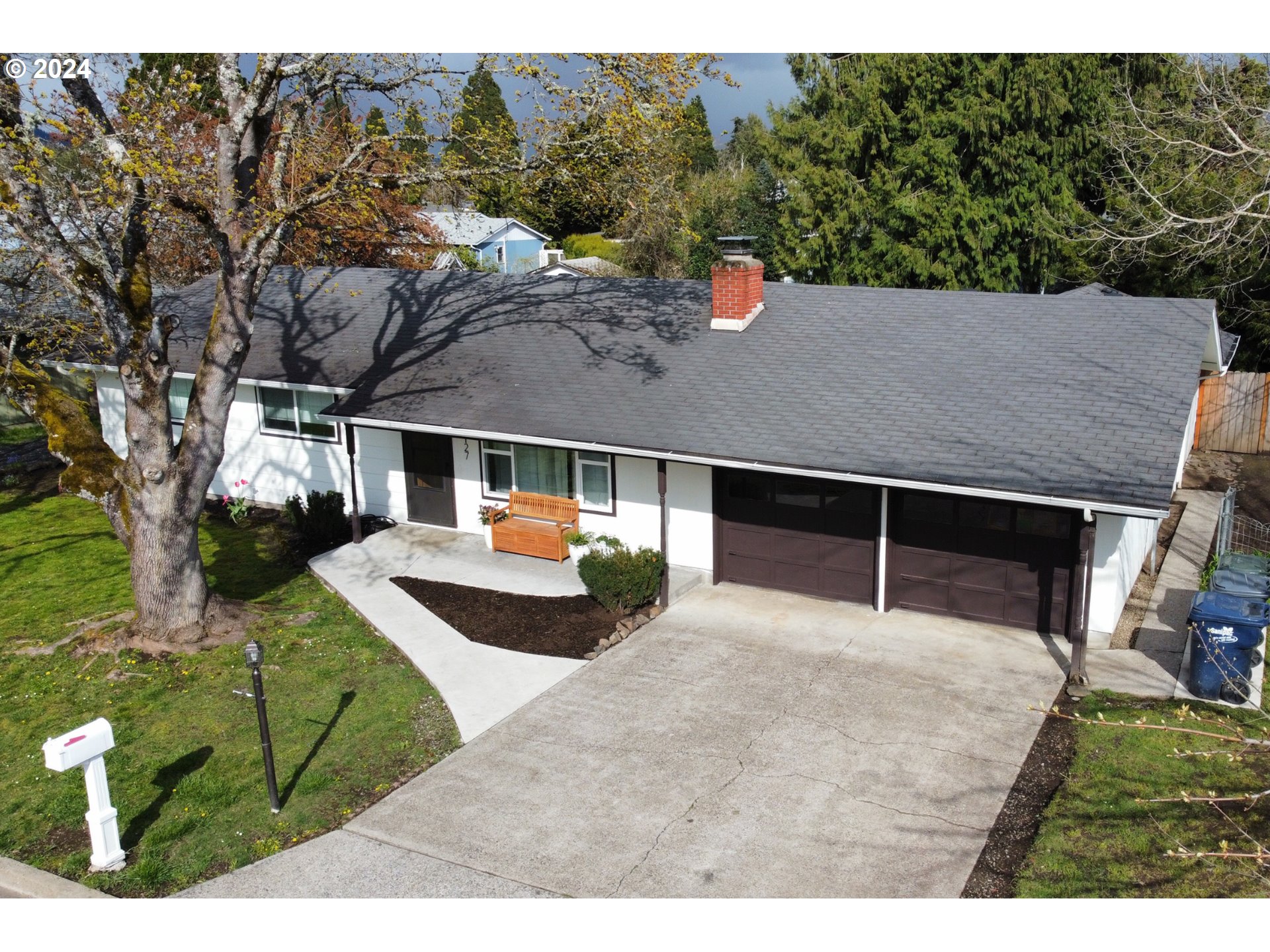 1127 South 34th Place Springfield, OR 97478 - Photo 5 of 40 a view of house with backyard and a garden
