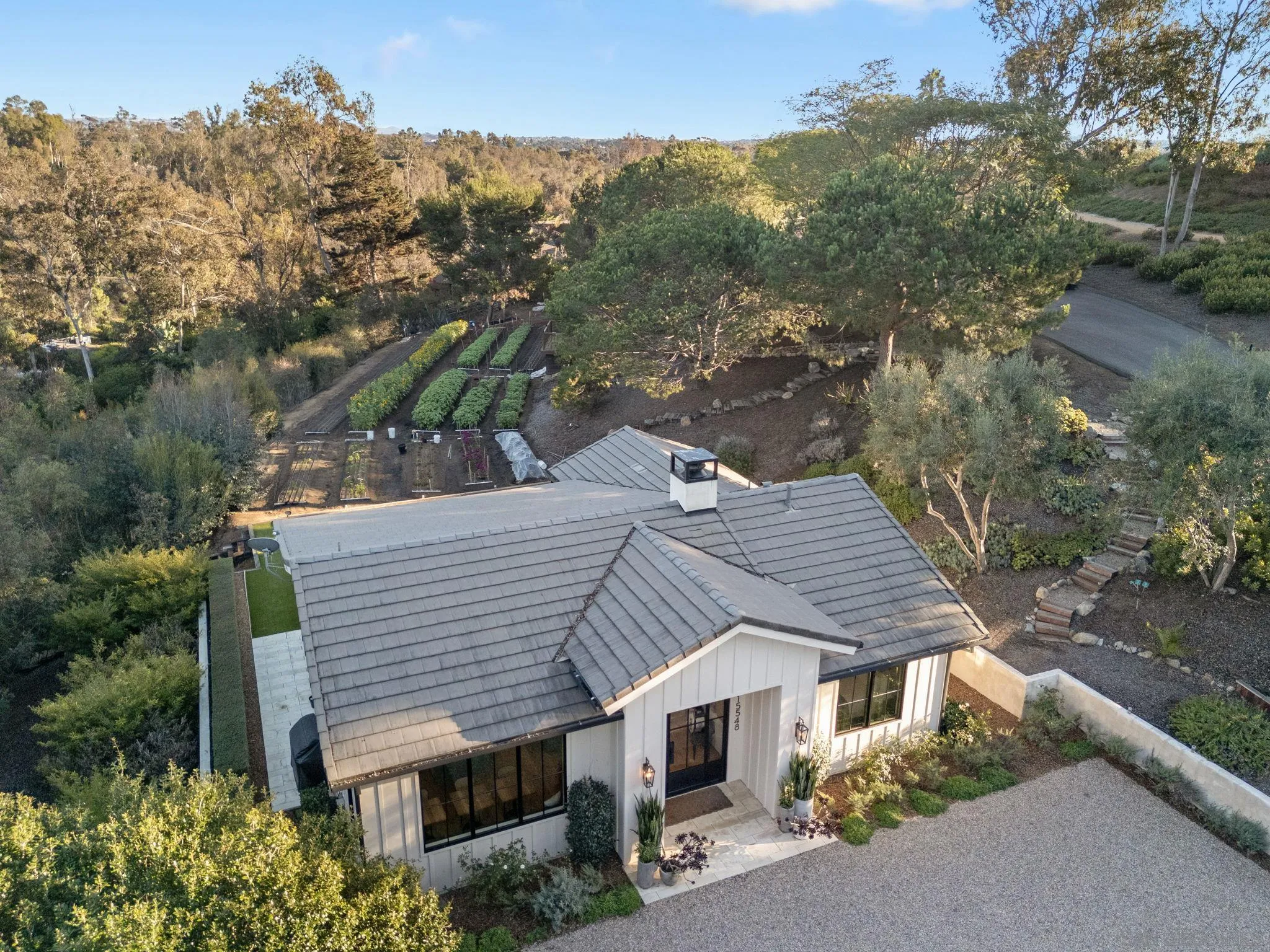 15550 El Camino Real Rancho Santa Fe, CA 92014 - Photo 33 of 35 a aerial view of a house with a yard