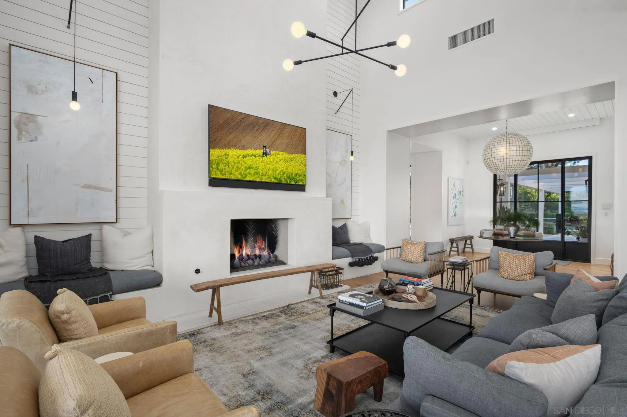 15550 El Camino Real Rancho Santa Fe, CA 92014 - Photo 6 of 35 a living room with furniture a fireplace and a flat screen tv