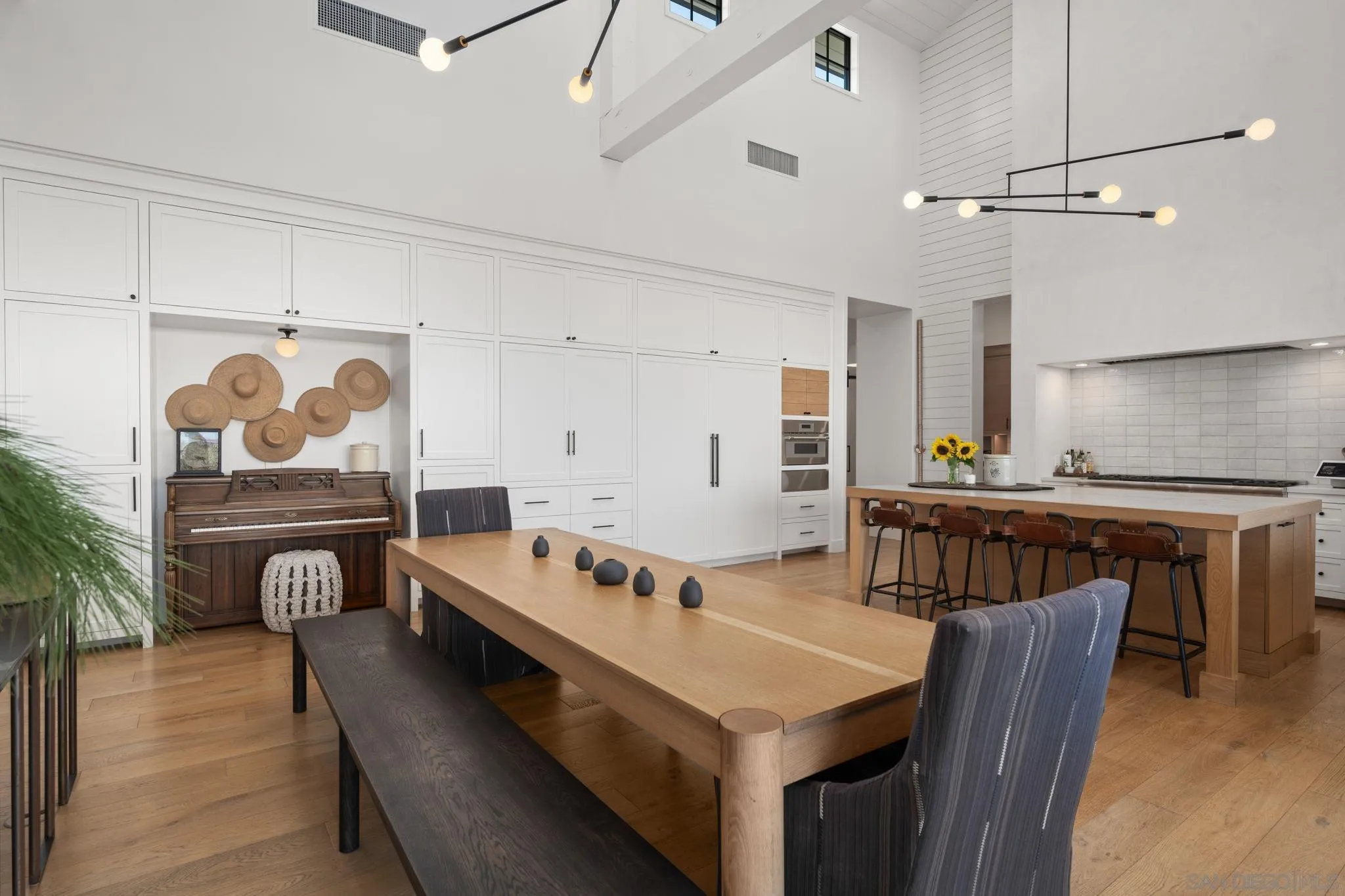 15550 El Camino Real Rancho Santa Fe, CA 92014 - Photo 8 of 35 a group of furniture sitting in a kitchen
