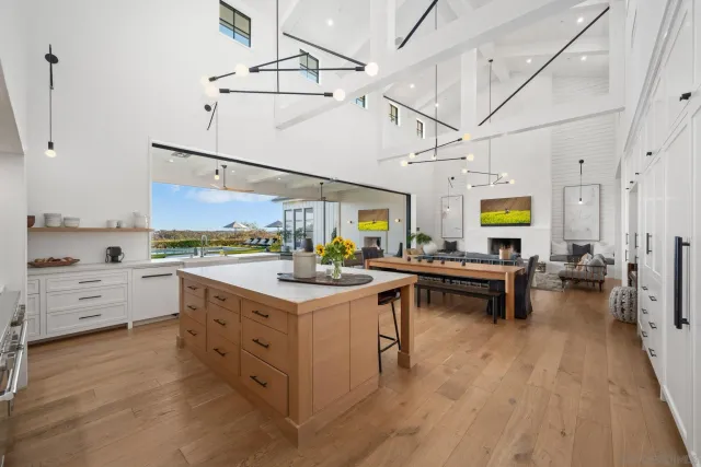 a kitchen with a sink cabinets and wooden floor