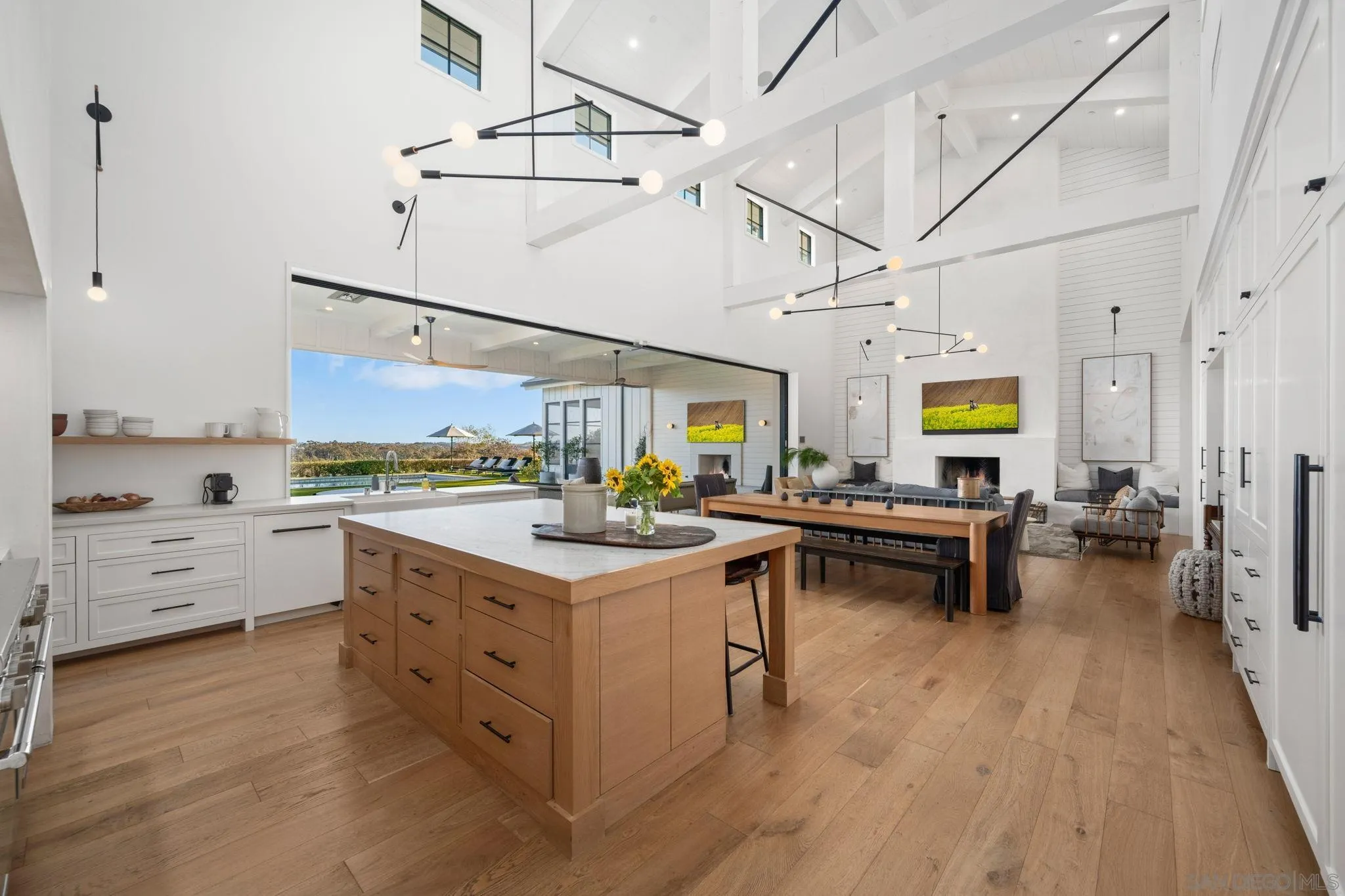 15550 El Camino Real Rancho Santa Fe, CA 92014 - Photo 9 of 35 a kitchen with a sink cabinets and wooden floor
