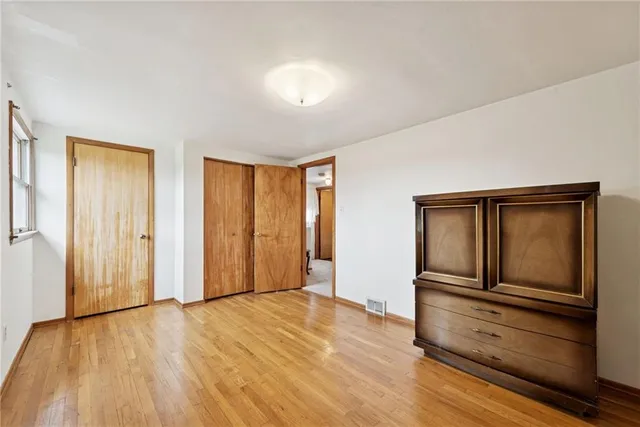 a view of a livingroom with wooden floor