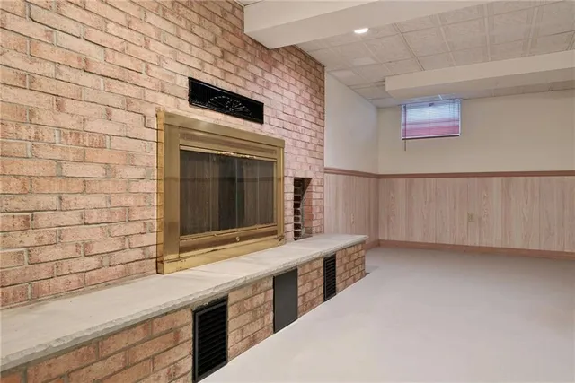 a bathroom with a sink a large mirror and a bathtub