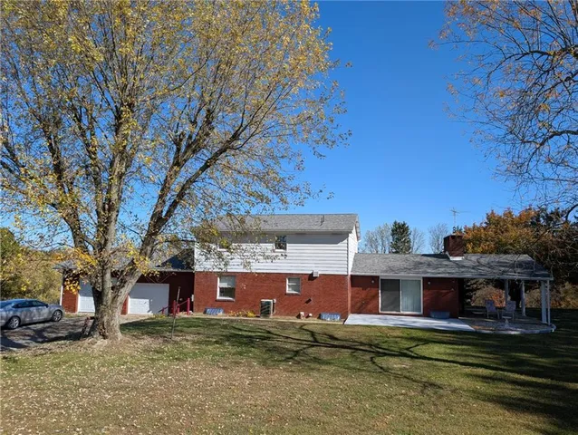 front view of a house with a big yard