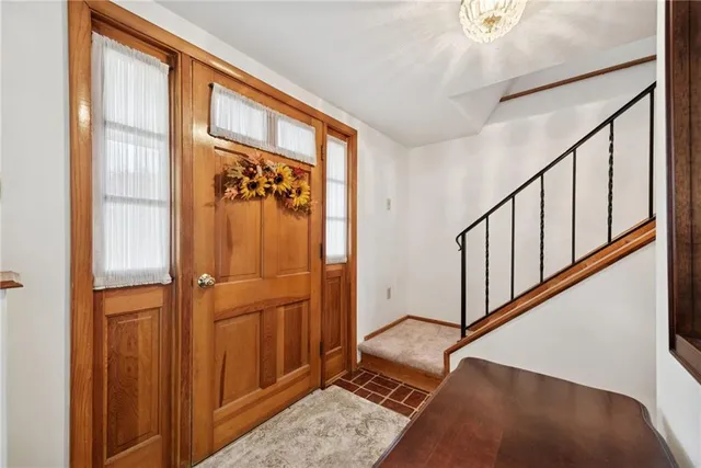 a view of an entryway with wooden floor