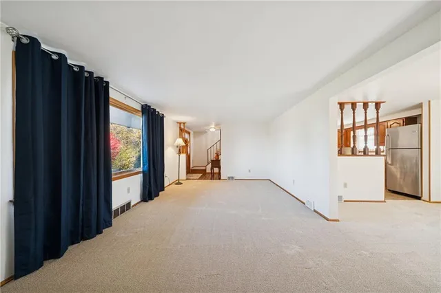 a view of an empty room with a window