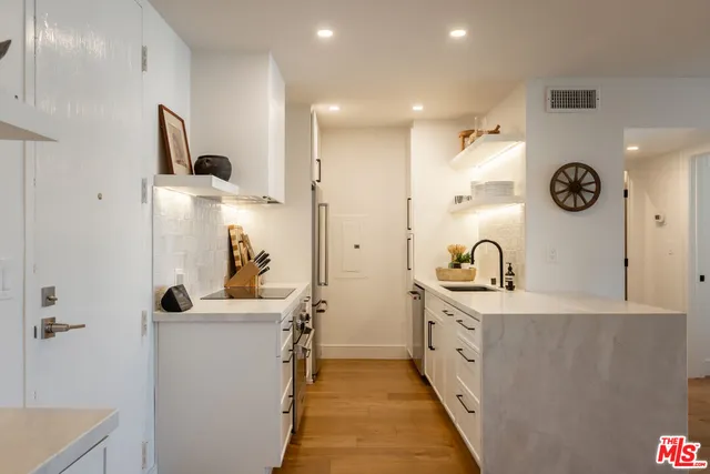a bathroom with a sink a mirror and a shower