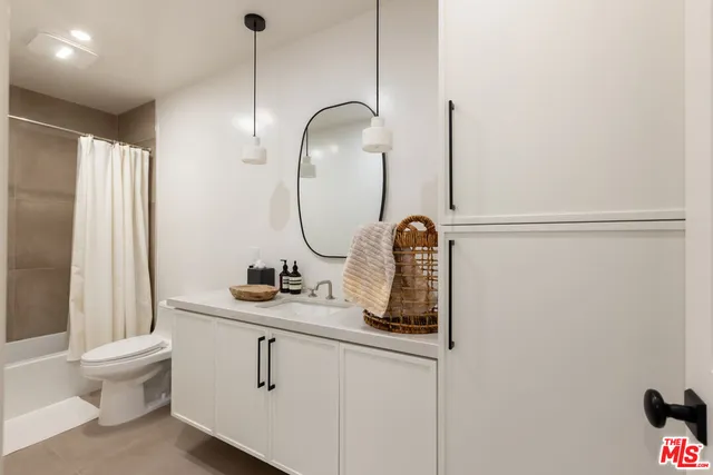 a bathroom with a shower and a bath tub