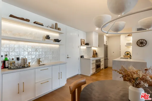 a kitchen with cabinets and window