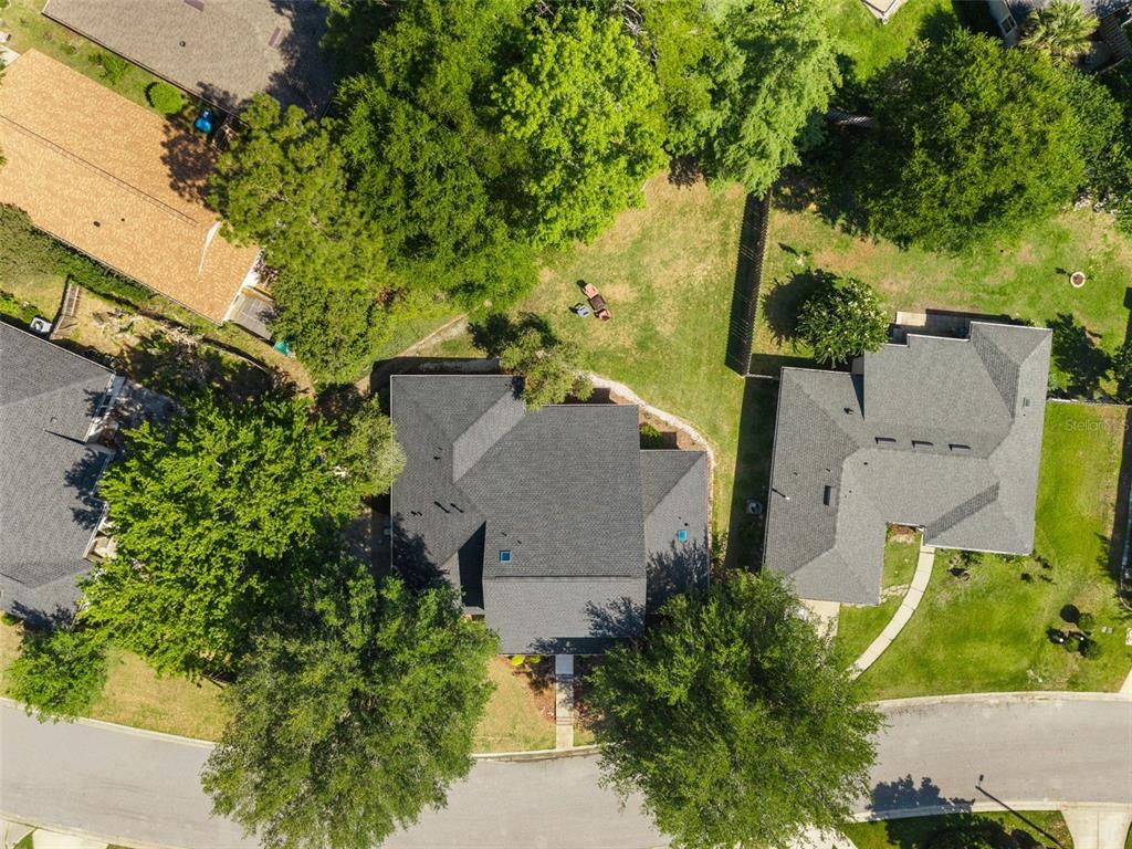 7418 White Oaks Road Alachua, FL 32615 - Photo 42 of 46 an aerial view of a house with a yard and garden