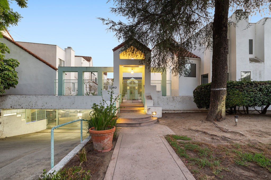 a front view of a house with garden