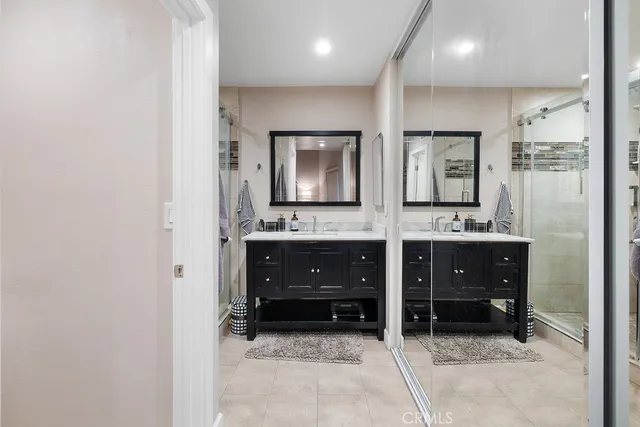 a bathroom with a sink and a large mirror