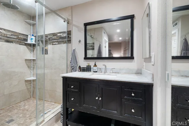 a bathroom with a double vanity sink mirror and double