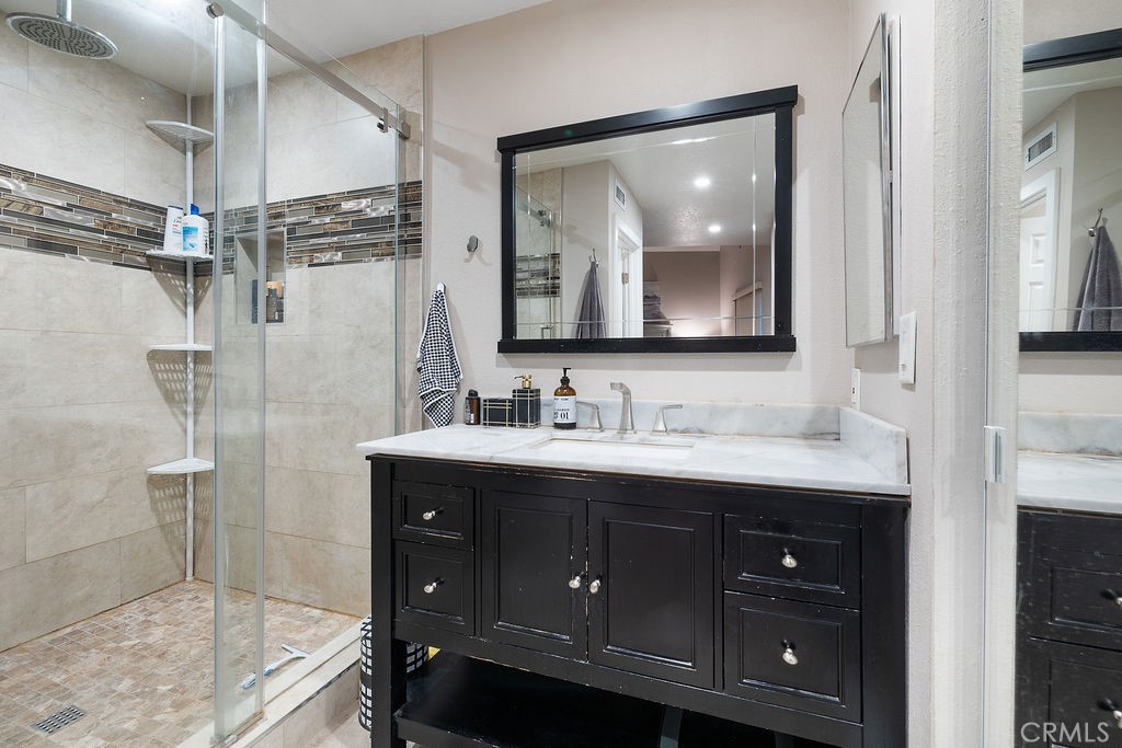 1340 Glenwood Road, Unit 8 Glendale, CA 91201 - Photo 18 of 20 a bathroom with a double vanity sink mirror and double