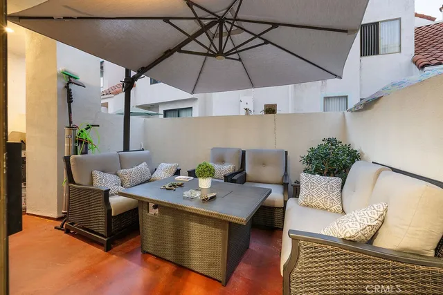 a patio with patio a table and chairs