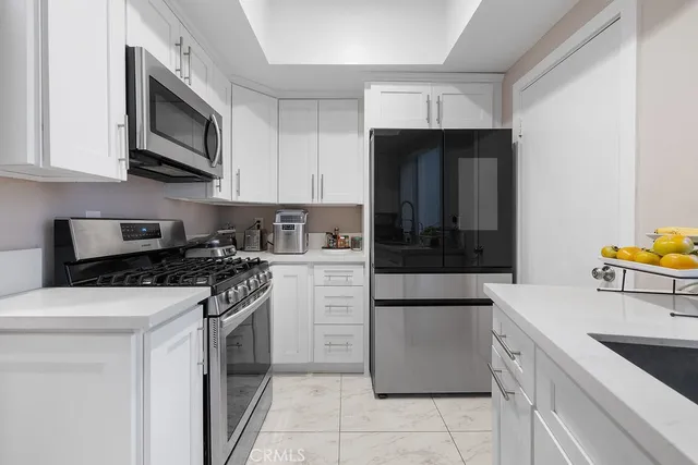 a kitchen with a stove and a microwave