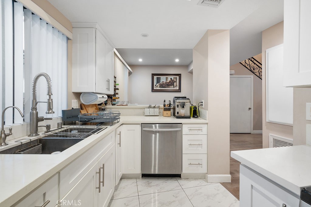 1340 Glenwood Road, Unit 8 Glendale, CA 91201 - Photo 8 of 20 a kitchen with cabinets appliances and a sink