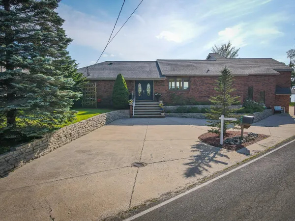 $1,200,000 | 815 East Lake Mitchell Drive, Cadillac, MI 49601